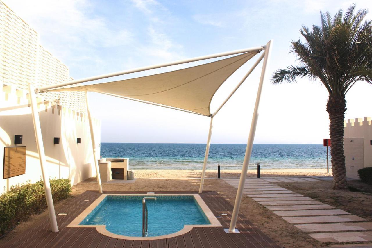 Sealine Beach, A Murwab Resort Mesaieed Extérieur photo A shade sail over a swimming pool
